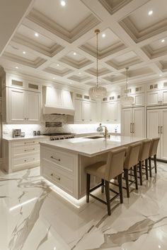 a large kitchen with marble floors and white cabinets