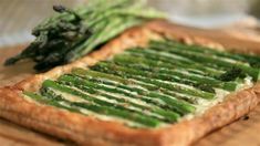 asparagus and cream cheese tart on a cutting board