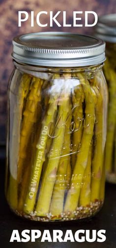 pickled asparagus in a jar with text overlay