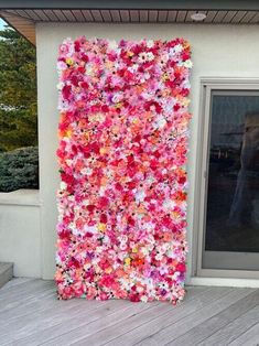 a large flowered wall on the side of a building