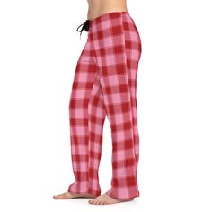 Add custom style to any loungewear collection with these custom-printed pajama pants. Their 100% polyester jersey knit fabric, along with the relaxed fit, makes for the ultimate comfort choice while kicking back at home. Meanwhile, the back elastic with the drawstring tie creates the perfect fit while the all-over-print adds a stylish dimension unique to your taste.  .: 100% polyester .: White seam thread .: Light fabric (6 oz/yd² (203 g/m .: Relaxed comfort fit .: Back elastic and black drawstring tie .: Sewn-in care label .: Assembled in the USA from globally sourced parts Festive Plaid Women's Christmas Pajama Pants | Christmas Pjs | Xmas | Seasonal Pyjamas | Check Print | Pink | Gifts For Her | Red and Pink Cozy Plaid Bottoms For Loungewear, Casual Plaid Bottoms For Sleep, Cozy Red Cotton Bottoms, Comfortable Red Bottoms For Lounging, Casual Red Pants For Sleepover, Cozy Red Loungewear Bottoms, Cozy Red Bottoms For Pajama Party, Plaid Long Pants For Pajama Party, Red Relaxed Fit Bottoms For Pajama Party