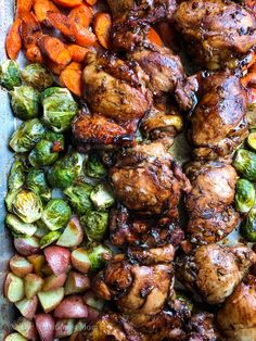 chicken, carrots, and brussel sprouts on a sheet pan