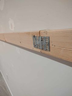 a piece of wood that is on the wall