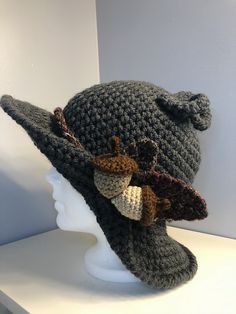 a crocheted hat on top of a mannequin head