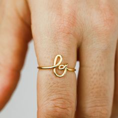 "Dainty Initial Ring, Personalized Letter Ring, Custom Stacking Initial Ring for Her Children Cursive Letter Ring Monogram Ring Birthday Gift * Sold individually All of our products are made of high quality SOLID 925 Sterling Silver. Delicate details make our Initial Ring in Silver a gorgeous addition to your finger! This beautiful piece is slim and trim, with a sweet cursive letter that lets you express yourself and to wear one on top of the other that make your look even more intriguing. This Gold Initial Ring With Simple Design For Wedding, Delicate Adjustable Initial Ring For Anniversary, Adjustable Initial Ring For Wedding, Adjustable Stackable Rings With Initials For Wedding, Initial Ring For Wedding, Adjustable Initial Ring With Detail For Anniversary, Adjustable Initial Ring With Simple Design For Wedding, Adjustable Simple Initial Ring For Wedding, Adjustable Stackable Wedding Rings With Initials