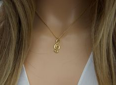 "Gold Treble clef necklace-silver table clef-gift for musician-music note jewelry-music symbol necklace-birthday gift-mother's day gift idea length: 15.5\"+2\" adjustable extension as shown on the pictures. pendant size:8mm x 21mm Material: gold dipped, white gold dipped( necklace )                 gold vermeil, sterling silver 925 with CZ (earrings) lobster clasp available: gold, silver comes with a cute little gift box. View more jewelry HERE: https://www.etsy.com/shop/DearMia?ref=shopsection_ Music Pendant, Nickel-free Music-themed Jewelry As Gift, Cheap Adjustable Music-themed Necklaces, Music-themed Pendant Jewelry As Gift, Music-themed Pendant Necklace As Gift, Music Note Jewelry, Silver Music-themed Necklace For Gift, Music-themed Pendant Jewelry Gift, Music-themed Pendant Necklaces As Gift