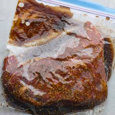 a piece of meat sitting on top of a plastic bag