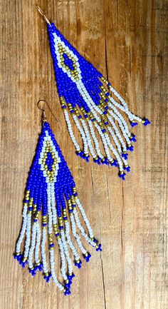 Beautiful blue white & gold beaded boho dangles with beaded fringe.Recycled.  surgical steel ear hooks. 4.5 cm long. Blue Fringe Dangle Chandelier Earrings, Blue Fringed Beaded Earrings For Festival, Blue Tassel Earrings With Round Beads, Blue Tassel Drop Earrings For Festival, Blue Tassel Earrings For Festivals, Blue Fringe Earrings For Festivals, Blue Beaded Fringe Dangle Jewelry, Blue Fringed Beaded Drop Earrings, Blue Beaded Earrings With Dangling Beads For Festival