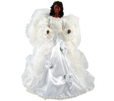 an angel figurine with white dress and flowers on it's chest, standing in front of a white background