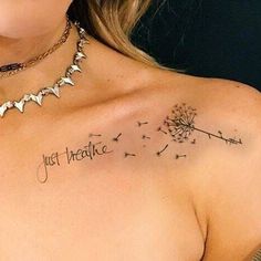 a woman with a dandelion tattoo that says just breathe on her chest and back