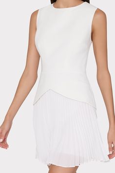 Minimal and versatile, the Haddy dress is just as suited for work as it is for cocktails. It has an extended bodice that hits the waistline in a flattering v-shape, giving way to a signature pleated chiffon mini skirt. Chic Fitted A-line Tops, Formal Pleated Dress With Fitted Bodice, Elegant A-line Mini Dress With Pleated Back, Elegant Structured Mini Dress, Elegant Cocktail Dress With Pleated Back, Structured Pleated Evening Dress, Classic Pleated Evening Dress, Classic Fitted Pleated Evening Dress, Elegant Structured Pleated Dress