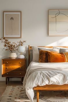 a bedroom with white walls and wooden furniture