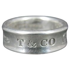 This gorgeous, authentic 1997 Tiffany & Co, 1837 concave band ring is sterling silver. Measurements: 7mm wide (considered medium) Size: 6 1/2 Condition: Excellent with original Tiffany & Co snap pouch Elsa Peretti, Tiffany And Co, Ring Sterling Silver, Morganite, Sterling Ring, Tiffany & Co., Band Ring, Medium Size, Band Rings