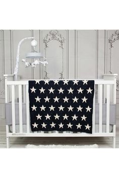 a black and white crib with stars on it