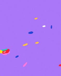 an image of colorful confetti falling down the middle of the air on purple background