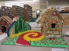 a gingerbread house is on display in the library