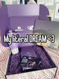 an open purple box with some items inside