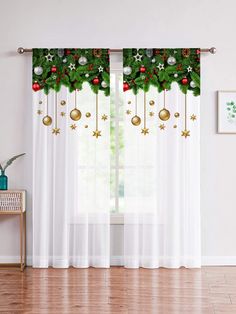 christmas decorations are hanging on the window curtain