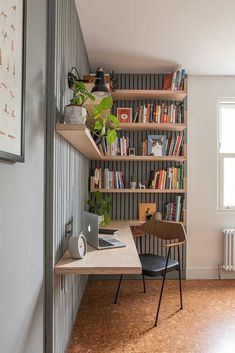 a home office with bookshelves, desk and chair