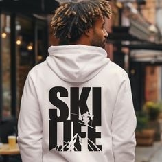 Stay cozy and stylish this winter season with our ski life hoodie! This unisex sweatshirt is the perfect gift for skiers and nature lovers alike. Embrace the ski life and stay warm with this mountain hoodie, featuring a spacious kangaroo pocket and a hood to keep you comfy and warm during all your après ski adventures. Adventure awaits with this y2k-inspired, cozy and stylish sweatshirt for all your winter sports activities. Embrace the winter games in style with our ski sweatshirt! This comfy unisex hoodie is the ideal nature lover gift for anyone who loves the great outdoors. Whether hitting the slopes or lounging by the fire, this sweatshirt is your go-to for warmth and comfort.   .: Made with a medium-heavy fabric (8.0 oz/yd² (271 g/m that consists of 50% cotton and 50% polyester for t Sporty Sweatshirt With Graphic Print For Outdoors, Sporty Sweatshirt With Graphic Print For Outdoor Activities, Sporty Hoodie With Letter Print For Outdoors, Casual Sweatshirt With Drawstring Hood For Winter Sports, Sporty Graphic Print Sweatshirt For Outdoor, Winter Sports Sweatshirt For Winter, Casual Hoodie For Winter Sports With Drawstring Hood, Casual Hoodie With Drawstring Hood For Winter Sports, Casual Long Sleeve Hoodie For Winter Sports