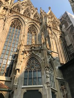 an old building with many windows and statues