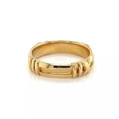 This lovely ring is by Tiffany & Co. from the Atlas Collection, the strong lines meet Roman numeral in a contemporary design that honors Tiffany's icon. The ring is crafted from 18k yellow gold with a platform grooved band and Roman letters in polished finish around the band.  It has the designer hallmark with the gold content.    Brand:  Tiffany & Co.   Hallmark: Tiffany & Co. 750  Measurement: band is: 4.5mm wide   Ring Size:  5.5  Weight:  4.5 grams Roman Letters, Wide Ring, Gold Band Ring, Wide Rings, The Atlas, Roman Numeral, Lovely Ring, Roman Numerals, Gold Band