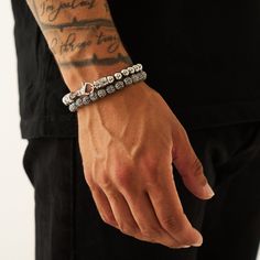 A master in disguise. With discreet emblem embellishment and a reinforced lobster clasp, there’s more to this bracelet than meets the eye. Built to be worn on repeat, each Silver sphere is hand-strung on a hidden metal chain, ensuring durability and a clean everyday aesthetic. ✓ 316L Stainless Steel & Rhodium✓ Water, Heat, Sweat Resistant✓ Hypoallergenic (No Green Skin)Model is 5'11 & Wears 19cm Length. Stone Bracelet Gold, Bead Bracelet For Men, Everyday Aesthetic, Metal Bead Bracelet, Relaxed Aesthetic, Chrome Ball, Skin Model, Green Skin, Ball Bracelet