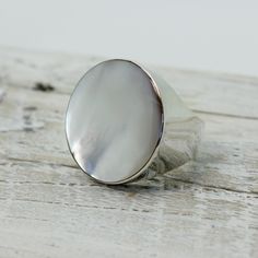 "Elegant white Mother of pearl round ring set on 925 sterling silver with a gorgeous genuine white mop cap quality jewelry solid quality work Dimensions Length x Width : 26 x 26 mm Weight 12.3 grams Colors : WHITE PEARL MOP RING SIZING is available if you need a bigger or smaller size choose option \"Ring + Resizing\" and put option in message box.  For resizing it takes 5 to 7 days before shipping / $20 usd done by laser" Mop Cap, Mop Jewelry, Black Obsidian Ring, Kunzite Ring, Morganite Pendant, Obsidian Ring, Natural Stone Earrings, Mother Of Pearl Earrings, Message Box