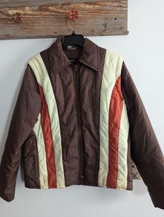 Vintage Vanderbilt Ski Jacket. In fantastic condition for age and use. Sleeves zip off and this converts into a vest. All zippers work. No rips or tears. May be some very light marks from use as this is a vintage item.  Chest: 20 inches  Sleeves: 25 inches  Shoulder to hem: 26 inches Retro Brown Outerwear With Zipper Closure, Vintage Brown Outerwear With Zip Fly, Vintage Outerwear With Zip Fly For Fall, Vintage Fall Outerwear With Zip Fly, Vintage Brown Outerwear With Zipper Closure, Retro Brown Outerwear For Cold Weather, Vintage Windbreaker For Cold Weather In Fall, Vintage Outerwear With Ykk Zipper For Fall, Vintage Ski Jacket