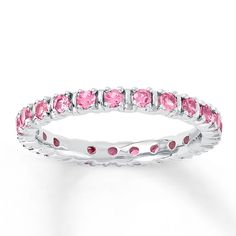 This stackable ring is made of sterling silver and wrapped in round lab-created pink sapphires. The band is 2.5mm wide. White Gold Wedding Bands Women, Jewelry Questions, Ruby Wedding Rings, Jewelry Advice, Jared The Galleria Of Jewelry, Pink Sapphire Ring, White Gold Wedding Bands, Plain Bands, Ladies Diamond Rings