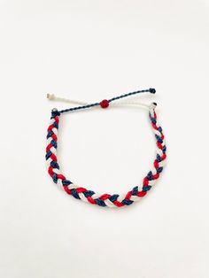 This fun patriotic braided bracelet is waterproof and adjustable! It is perfect for any 4th of July Party! It would also make a nice gift. Stack it with other bracelets, or wear it by itself! ∙ ∙ ∙ ∙ ∙ ∙ ∙ ∙ ∙ ∙ ∙ ∙ ✦ PLEASE NOTE ✦ When you first receive this bracelet, it may feel slightly waxy, which may make it more difficult to adjust. The waxy texture does not last. After a day or two of wearing, the waxy texture will fade, and it will be much easier to adjust. It will still be waterproof an Blue Adjustable Bracelets For 4th Of July, Adjustable Red Beaded Bracelets For 4th Of July, Patriotic Red Adjustable Beaded Bracelet, Patriotic Red Friendship Bracelet As Gift, Patriotic Blue Bracelets For Beach, Blue Friendship Bracelets For 4th Of July Gift, Red Adjustable Bracelets For Independence Day, Adjustable Red Bracelets For Independence Day, Adjustable Red Beaded Bracelet For Independence Day