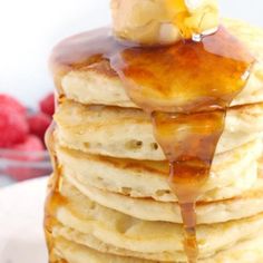 a stack of pancakes with syrup on top