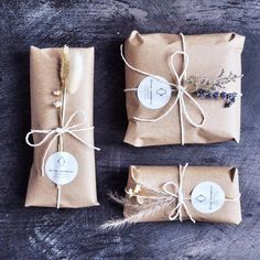 three wrapped gift bags tied with twine