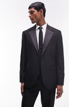 A skinny fit enhances the contemporary appeal of this tuxedo jacket classically detailed with contrast lapels. 30 1/2" length (size 42r) One-button closure Notched lapels Nonfunctional four-button cuffs Chest welt pocket; front flap pockets Partially lined 77% polyester, 17% viscose, 6% elastane Machine wash, line dry Imported Single Breasted Tuxedo Sport Coat For Black-tie Events, Single-breasted Tuxedo Sport Coat For Black-tie Events, Black Single Button Blazer For Evening, Black Single Button Evening Blazer, Tailored Tuxedo Outerwear For Black Tie Events, Tuxedo Blazer With Hidden Button Closure For Black Tie, Black Tie Tuxedo Blazer With Hidden Button Closure, Tailored Blazer With Lapel Collar For Black-tie Events, Black-tie Tuxedo With Pressed Crease And Long Sleeve