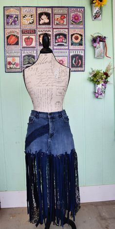 a mannequin wearing a skirt made out of old jeans with fringes on it