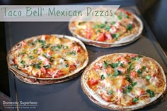 three homemade mexican pizzas sitting on top of a baking sheet with the words taco bell mexican pizzas