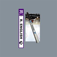 an ice hockey stick with the number 28 on it is in front of a rink