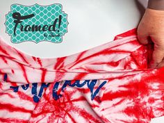 someone is making a tie - dyed t - shirt with the word'framed'on it