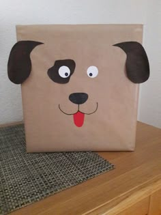 a brown paper bag with a dog's face painted on the front and side