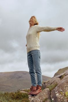 A symbol of Ireland past and present, the Inisheer Traditional Aran Sweater is a timeless addition to your wardrobe. Made with 100% Merino wool, the quality of this authentic Irish gem cannot be rivalled. It is a true Irish hero Aran piece. Much like its namesake, the Inisheer Aran Sweater captures the essence of Ireland in all of its glory. With a beautiful combination of traditional Aran stitches such as honeycomb, moss and cable, this piece is inspired by the past while remaining firmly roote Irish Style Fashion Women, Irish Outfits Women, Aran Stitches, Cream Sweater Outfit, Irish Knitwear, Irish Clothing, Aran Jumper, Irish Style, Irish Fashion