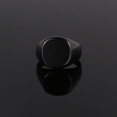 The Black Onyx Ring - Part of our new Blacked out collection. Created using real cuts of a black Onyx stone. Every stone is unique making it the perfect Ring for your unique style. This is our Latest Larger Signet Ring! Available in three different gemstones!  Available in Black / Silver / 18K Gold. Also available in Black Onyx (Real stone) & Green Opal (Lab Created) & Lapis Lazuli (Royal Blue) Unisex ring, womens sizes available.  DETAILS  Materials: Stainless Steel (Base) & 18K Gold PVD Platin Elegant Black Stainless Steel Rings, Minimalist Black Rings For Formal Occasions, Elegant Black Stainless Steel Signet Ring, Classic Black Open Signet Ring, Black Classic Open Signet Ring, Modern Black Round Rings, Modern Black Promise Ring, Black Stainless Steel Open Ring, Modern Black Adjustable Rings