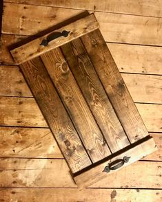 a wooden box sitting on top of a wooden floor