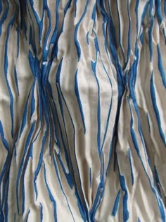 blue and white fabric with wavy lines on it