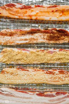 bacon and other meats are cooking on a wire rack in the oven, ready to be cooked