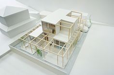 an architectural model of a house with white walls and floors