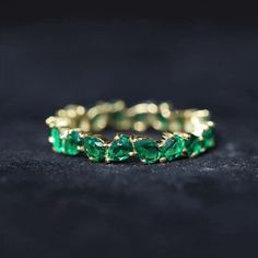 Product Details Express your love with this exquisite Eternity Band Ring, designed for ladies. The ring showcases pear-shaped created emerald gemstones, beautifully arranged in an elegant claw setting. Let this stunning ring be a symbol of your eternal love and admiration, a cherished piece that will make her feel truly special and loved. Product Information SKU SHP-RINGS0821190719 Width 2 mm Height 3.5 mm Weight 1.84 gm (Approximate) LAB CREATED EMERALD INFORMATION No.of Stones 22 Pieces Total Weight 4.40 Carat (Approximate) Dimension(approx) Pear-3X4 mm-22 Pcs Color Green Cut Brilliant Shape Pear Setting Type Claw-Set Quality Grade AAAA View More Product Parent Collection Handle eternity-rings Elegant Emerald Eternity Band, Emerald Eternity Ring Stone, Fine Jewelry Pear-shaped Emerald Ring, Emerald Gemstone Eternity Band In Fine Jewelry Style, Green Emerald Eternity Band Fine Jewelry, Lab Created Emerald, Claw Setting, Eternity Band Ring, Emerald Gemstone