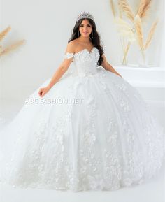 Look like a fairy-tale princess in this long off shoulder sweetheart neckline A-line dress with 3D floral tulle ball gown skirt. This glamorous off shoulder ball gown beautifully accented with 3D floral appliques blooming across the bodice. A sweetheart neckline tops the full tulle skirt accented with pearl and sequined embellishments. This dress is finished with a lace-up back with long royal train. House of Wu Quinceanera Collection Fall 2022 Style Number: 26024 Fabric: 3D Floral/Pearls Sparkl Floral Quinceanera Dress, White Quince Dress, White Quince Dresses, Quince Dresses White, Train House, White Quince, White Quinceanera Dresses, Quincenera Dresses, Quinceanera Collection