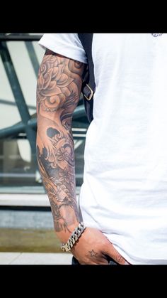 a man with a tattoo on his arm