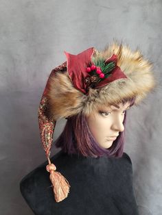 SIZING  The short hats fit average heads of 22 to 23 inches and have a fur pom pom, and the mid-length hats fit 23 to 24 inch heads and all have tassels for the pom.     These hats are made from a gorgeous rich cranberry brocade fabric. It has gold and black stitching throughout it with a big bold pattern. The patterns will vary from hat to hat, and these hats are not lined.     The short hats have a fur pom pom that matches the brim. The brims are cut generously and need to be cuffed down so th Brown Curved Brim Costume Hat For Winter, Brown Winter Costume Hat With Curved Brim, Adjustable Winter Hats For Costume Events, Adjustable Hats For Winter Costume, Winter Festival Top Hat With Curved Brim, Adjustable Christmas Costume Hats, Winter Festival Top Hat With Short Brim, Whimsical Winter Hat With Short Brim, Winter Hat With Feather Trim