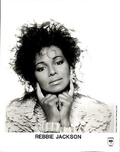 a black and white photo of a woman with curly hair